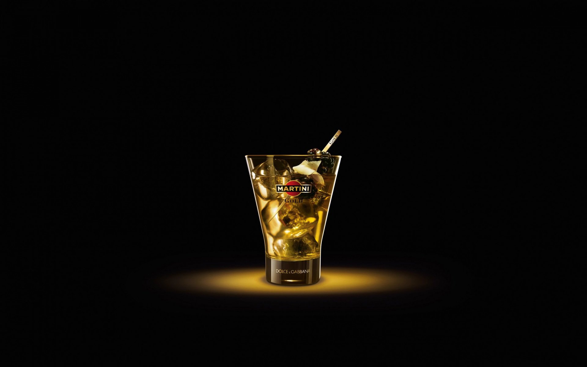 A martini glass on a black background. Simplicity of style
