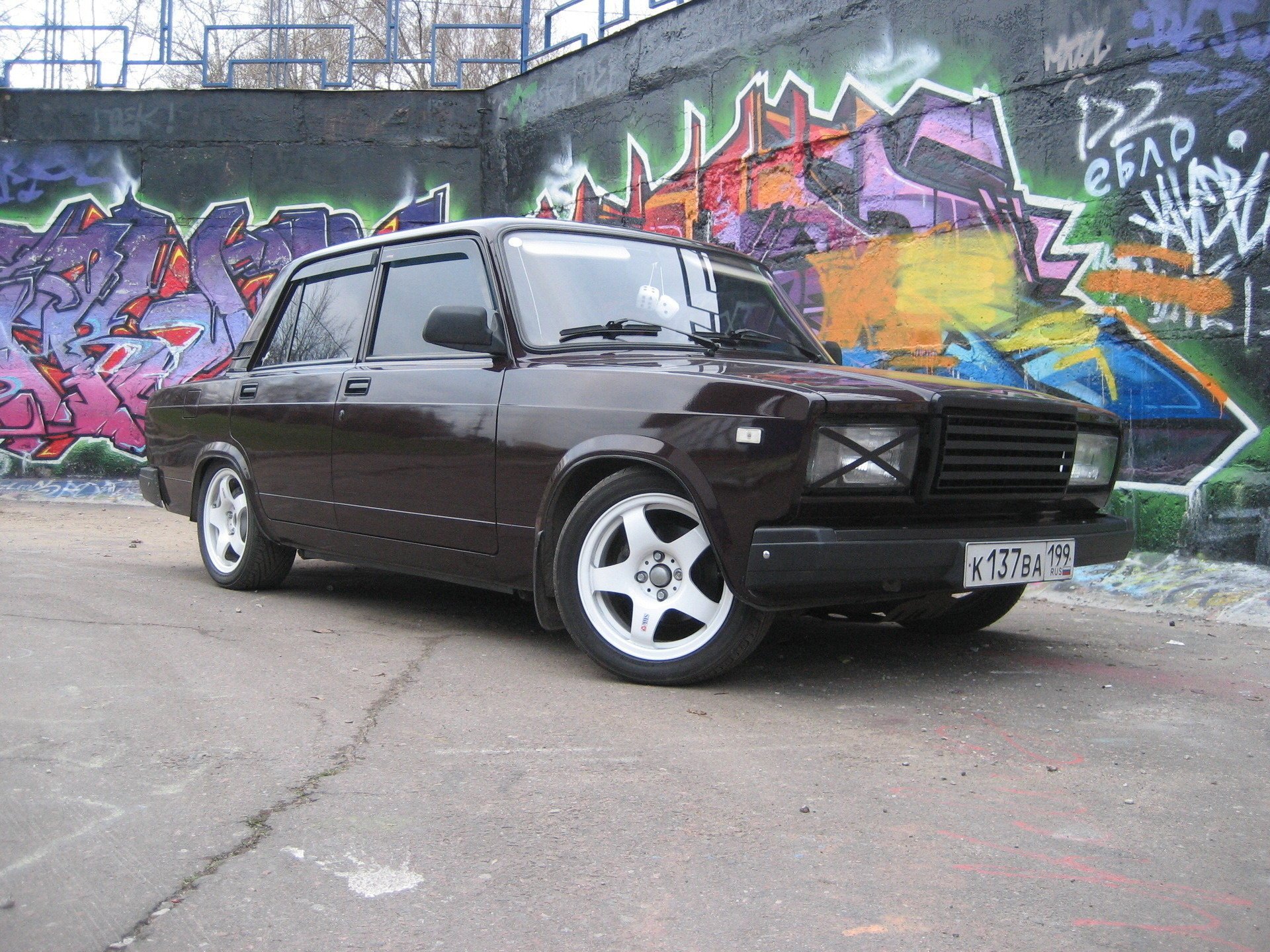 Zhiguli car on the background of a wall with graffiti