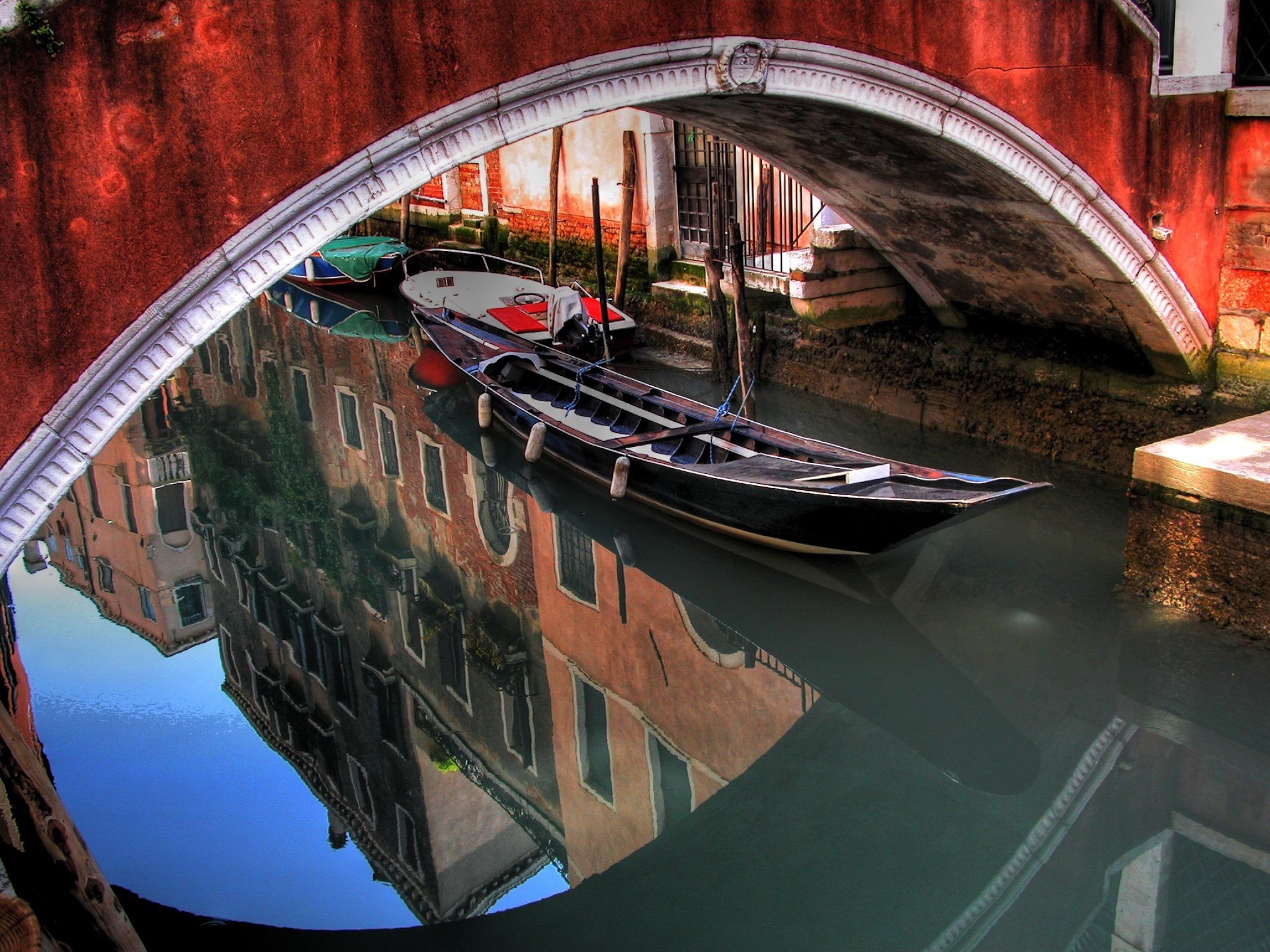 arch bridge reflection boat water