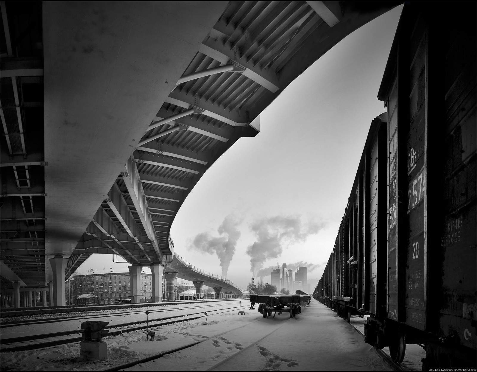 winter snow black and white railroad cars bridge