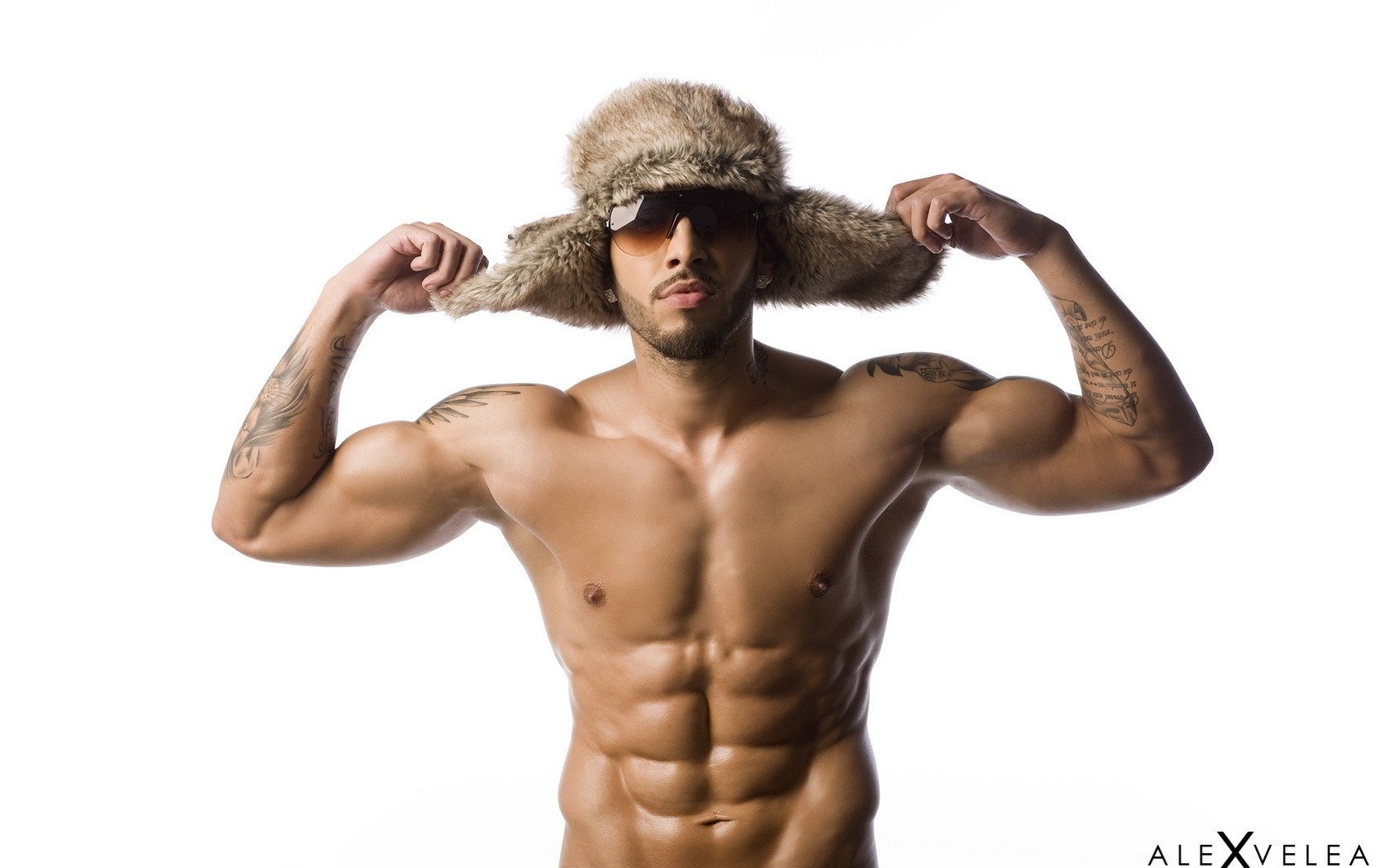 A beefy man in a fur hat