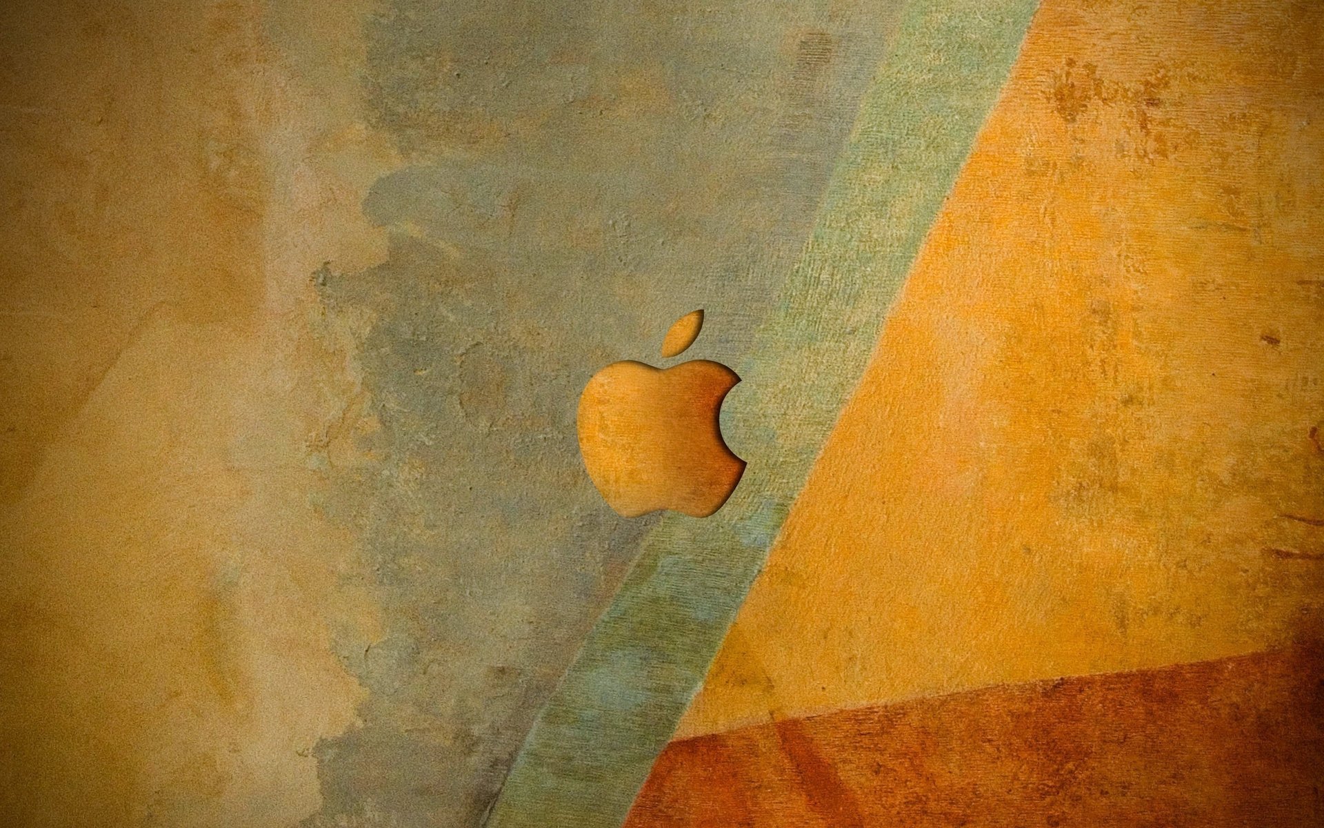 Apple logo in orange shades on the background of the wall