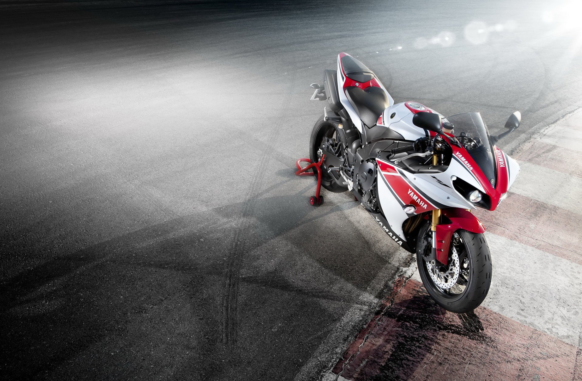 White and red motorcycle on the track