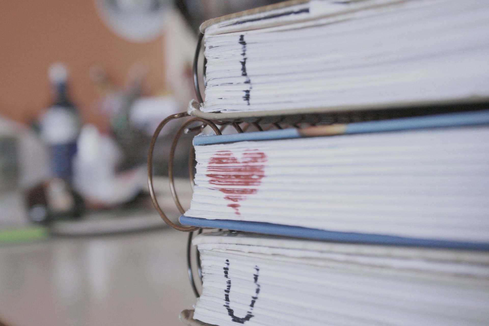 A stack of books marked with a sign of love