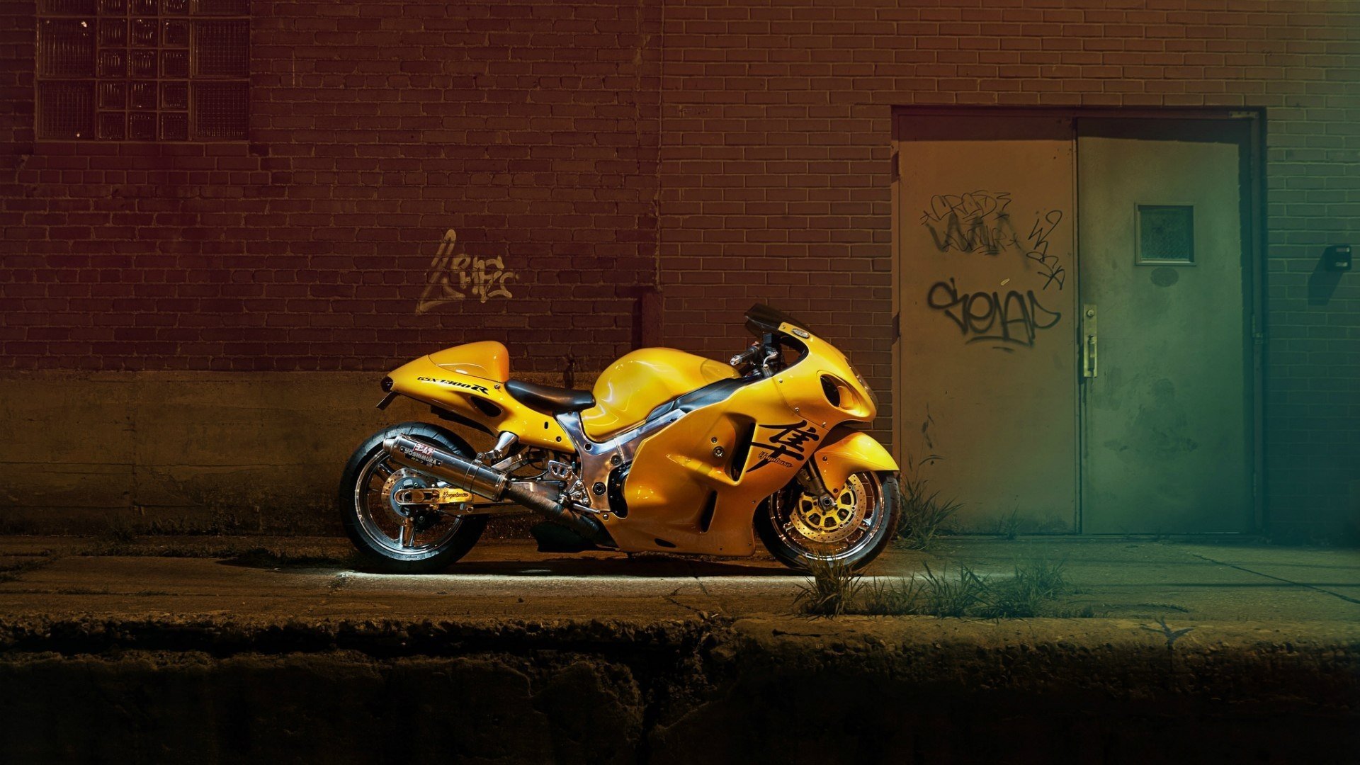 Yellow motorcycle next to the door