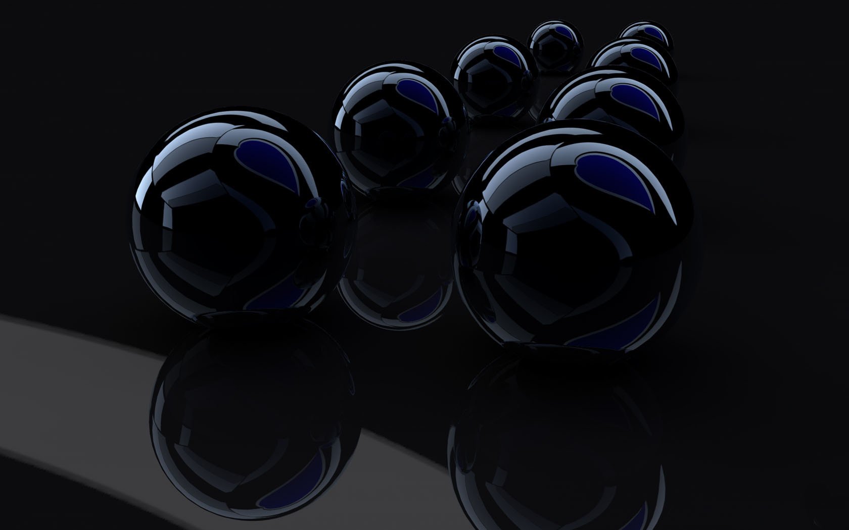 Voluminous black balls on a black background