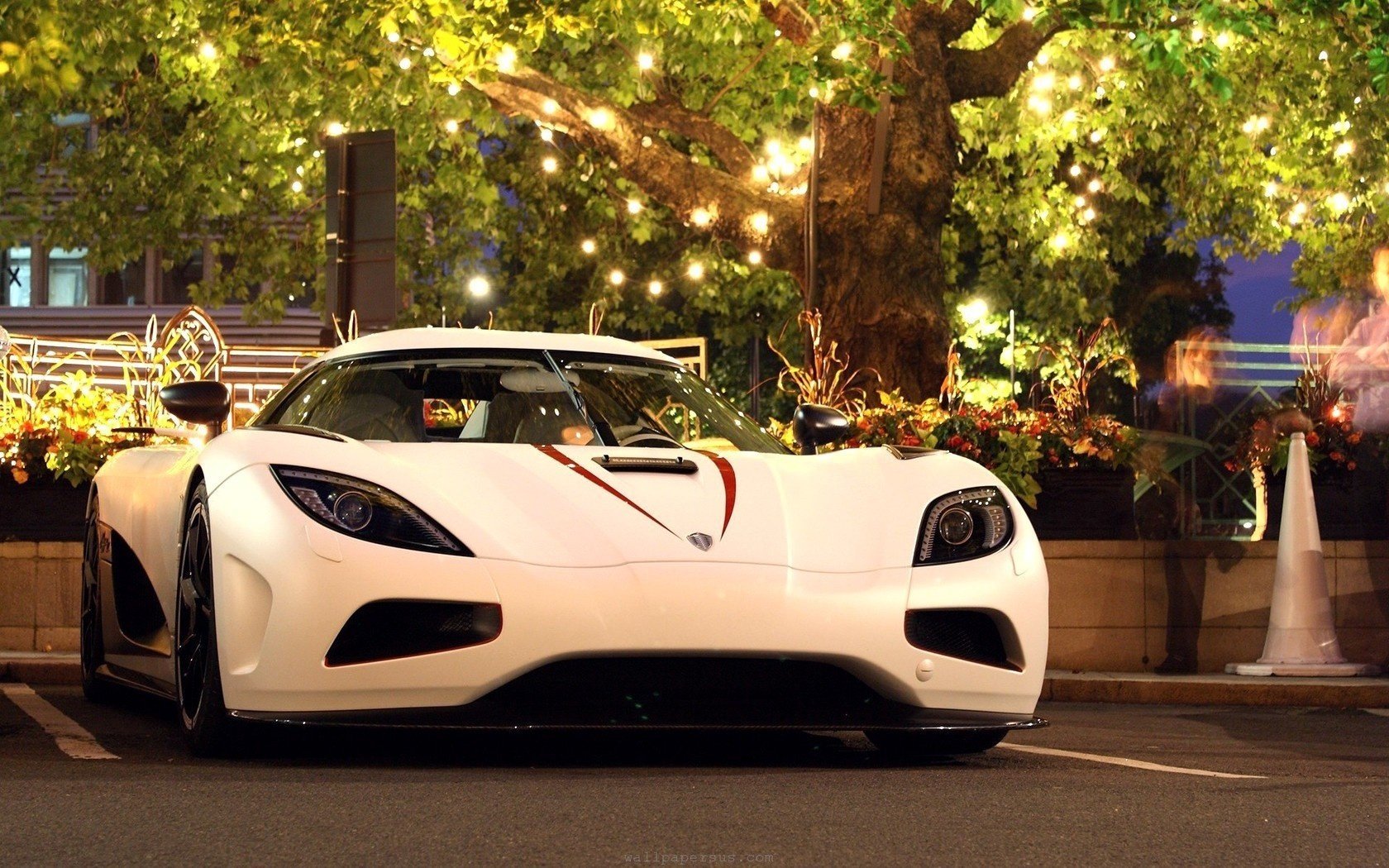 White hypercar in the parking lot
