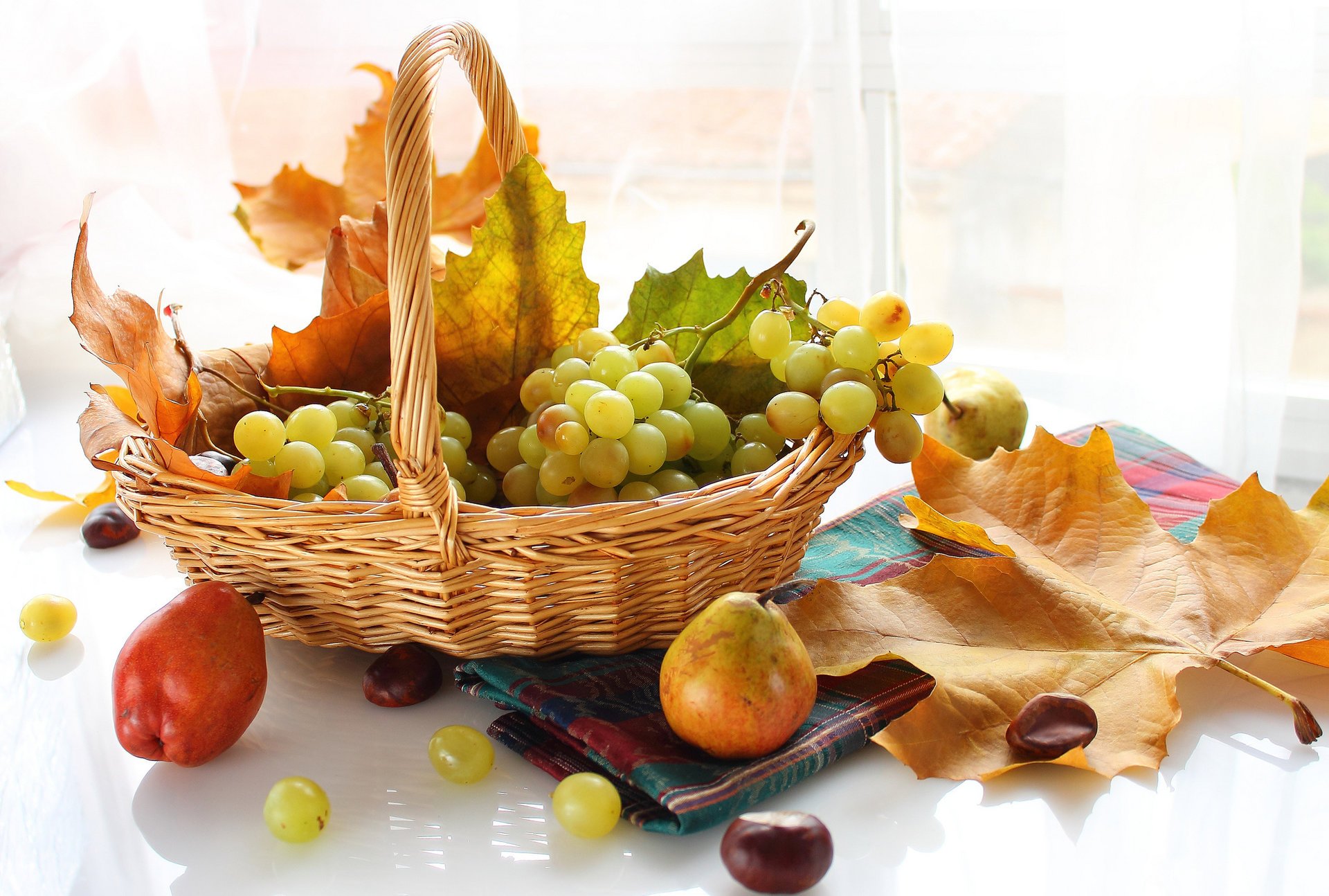 Basket with grapes and pears
