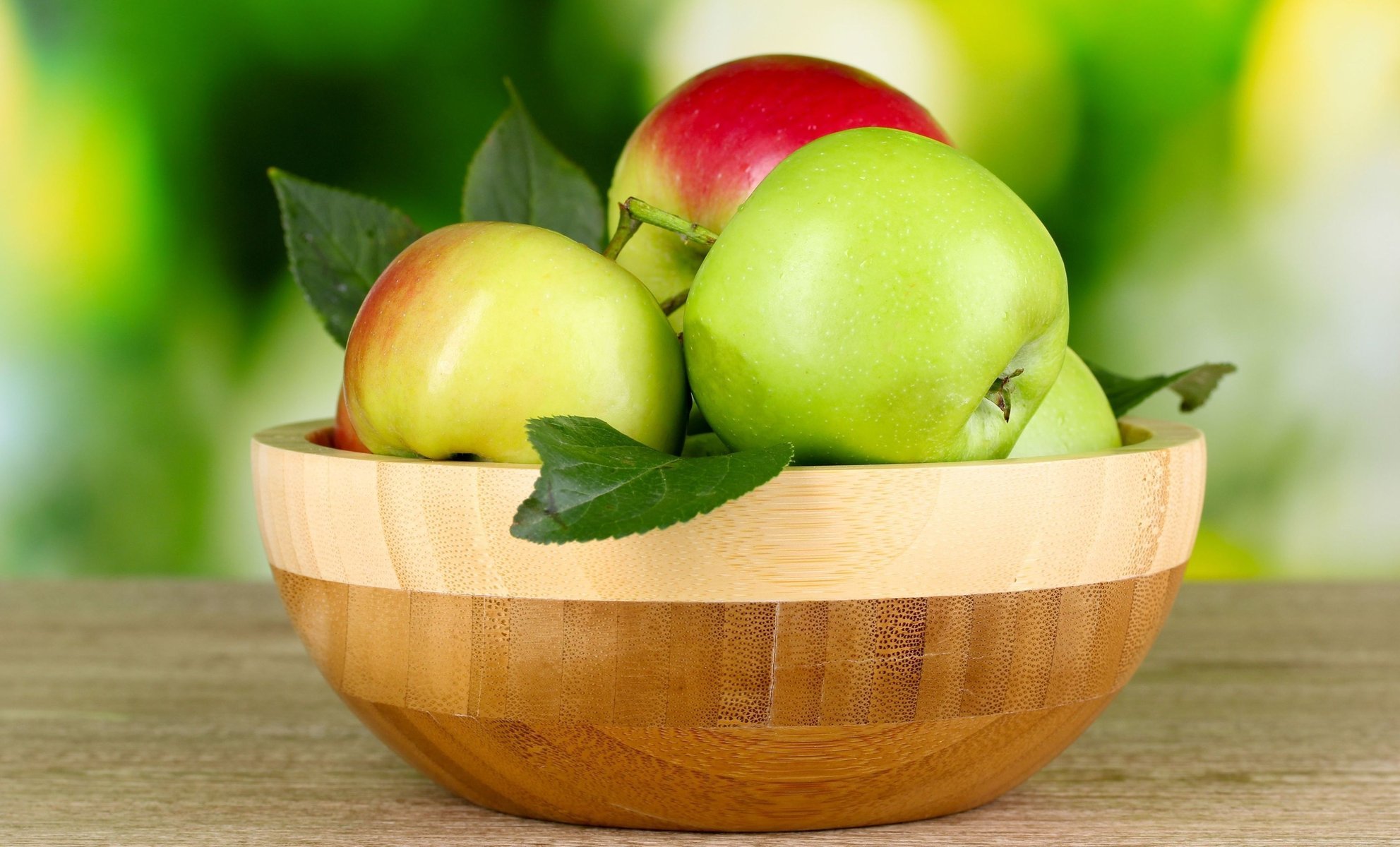 Green apples on a wooden table